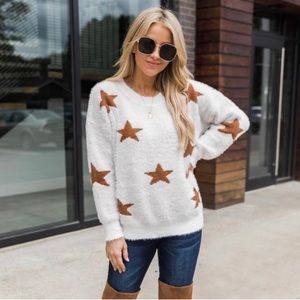 Cream star fuzzy sweater.